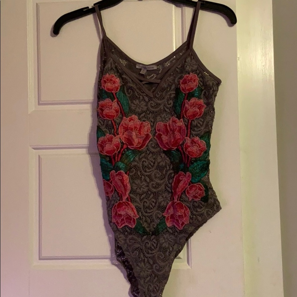 gray and floral body suit